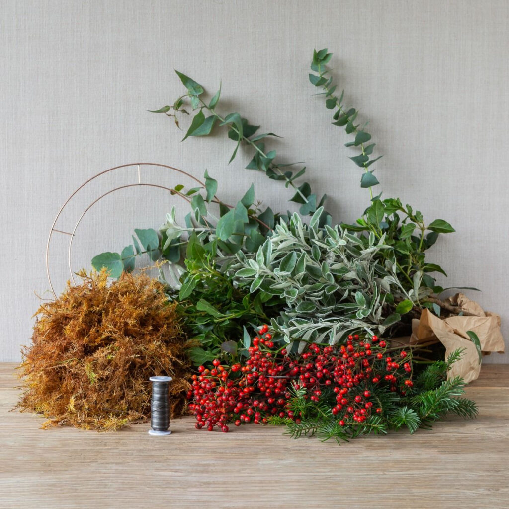 Evergreen herbs and berries are beautiful additions to a festive wreath
