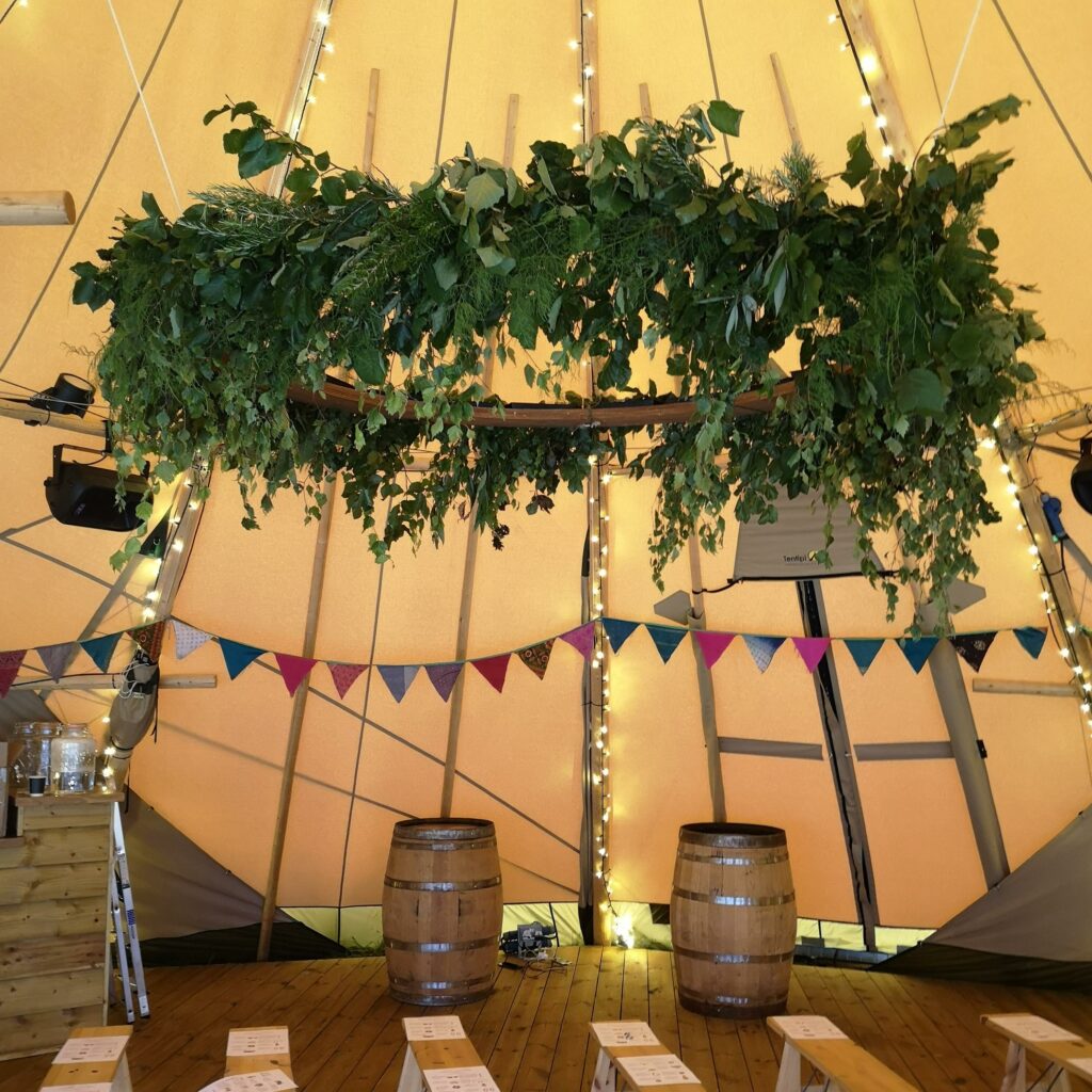 A spectacular foliage hoop for a tipi festival wedding by Greenery Flowers