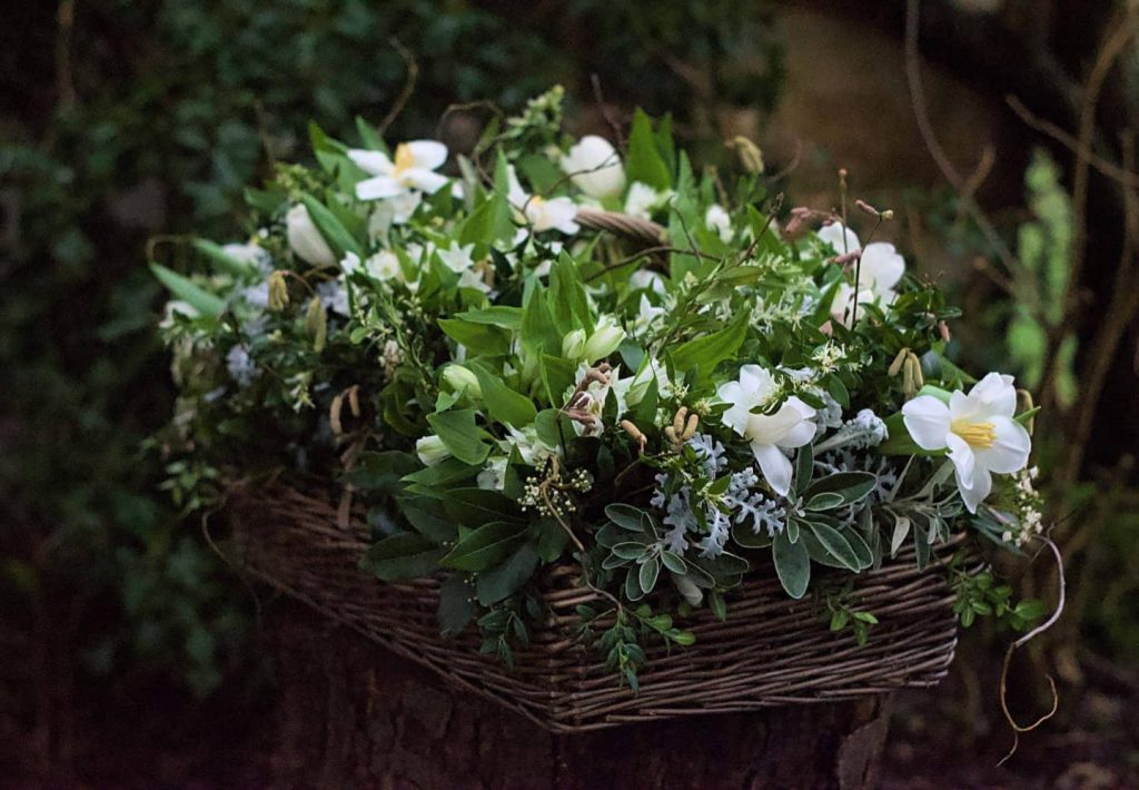 A winter basket of flowers for a funeral by Ivydene Flowers
