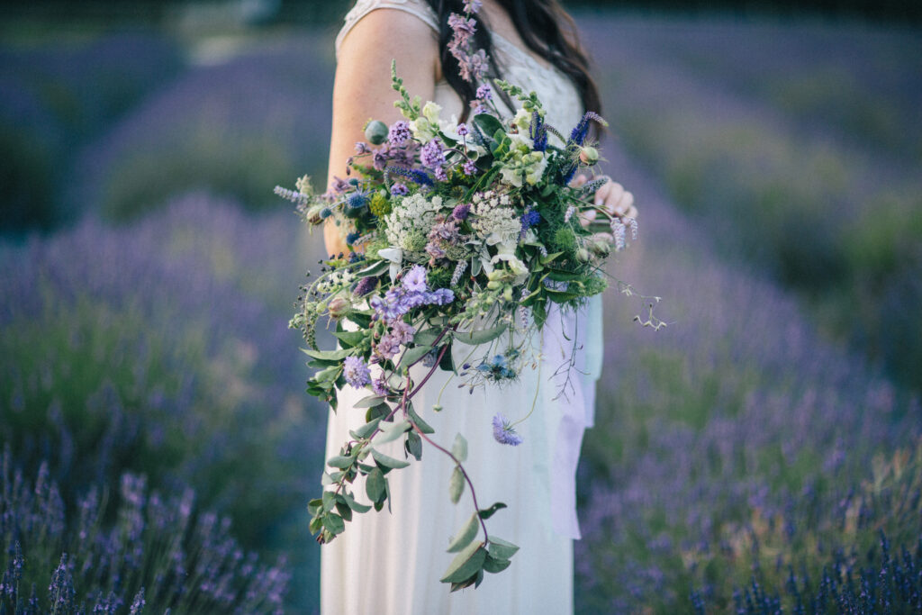 A wild cascading wedding bouquet with early summer British flowers by The Flower Farm